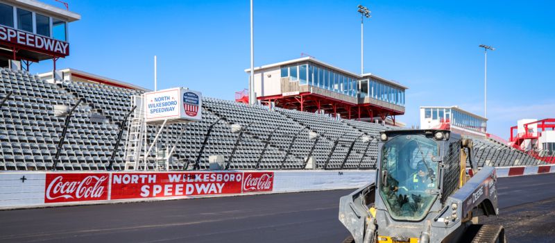 Crews repave the front stretch at North Wilkesboro Speedway as the Speedway Motorsports facility prepared for the 2024 NASCAR All-Star Race at the iconic short track.