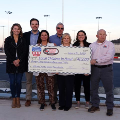 Speedway Children’s Charities on Tuesday presented a $40,000 check to four deserving area nonprofits at North Wilkesboro Speedway. From left: Betsy Holleman (Speedway Children's Charities Senior Manager of Business Development), Taylor Kirby (Speedway Children's Charities), Jessica Fickenscher (National Managing Director, Speedway Children's Charities), John Triplett (Director of Wilkes Ministry of Hope), Jean Davis (Executive Director of Ebenezer Christian Children’s Home), Sierra Watson (Interim Director of Safe Spot Child Advocacy Center of Wilkes) and John Soots (Blue Ridge Opportunity Commission Board Chair).