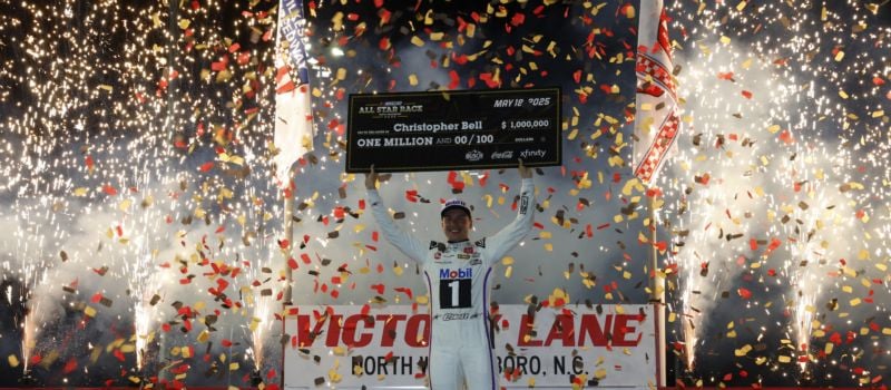 Joe Gibbs Racing driver Christopher Bell celebrates in North Wilkesboro Speedway’s Victory Lane after conquering the 250-lap NASCAR All-Star Race. 