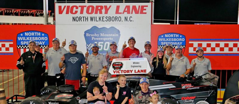 Matt Hirschman celebrates in the famed North Wilkesboro Speedway victory lane after winning the NASCAR Whelen Modified Tour's Brushy Mountain Powersports 150.