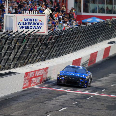 Daniel Suarez won the first of two Saturday heat races for the NASCAR All-Star Race at North Wilkesboro Speedway, clinching pole position for Sunday's event.